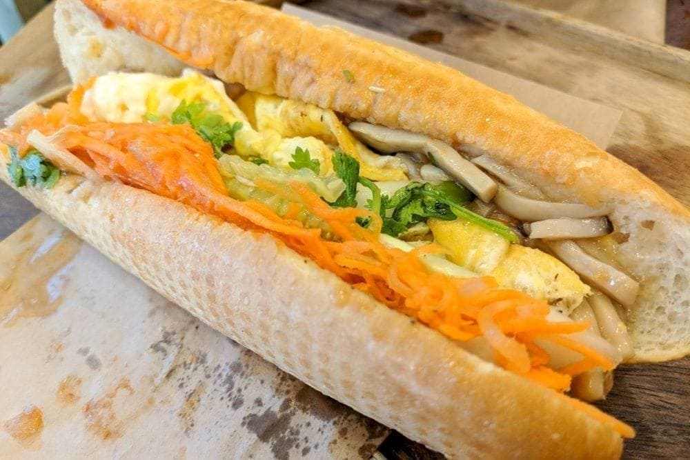 Banh Mi 25 offers a variety of fillings, including grilled pork, pâté, and fried eggs, all in a crispy baguette